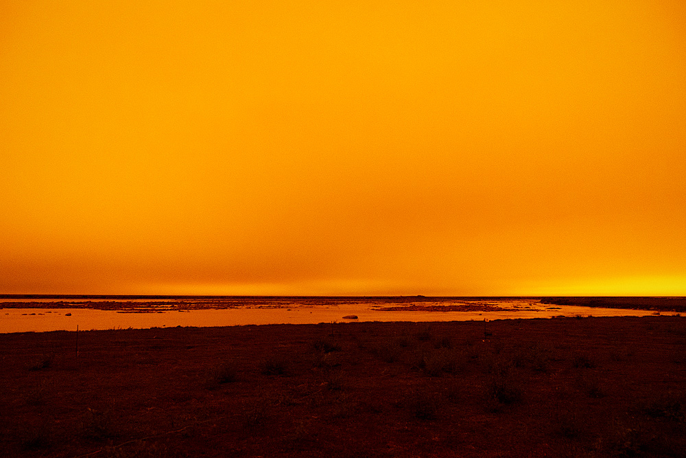 View of smoke covered sky in Arviat from forest fires in NWT.