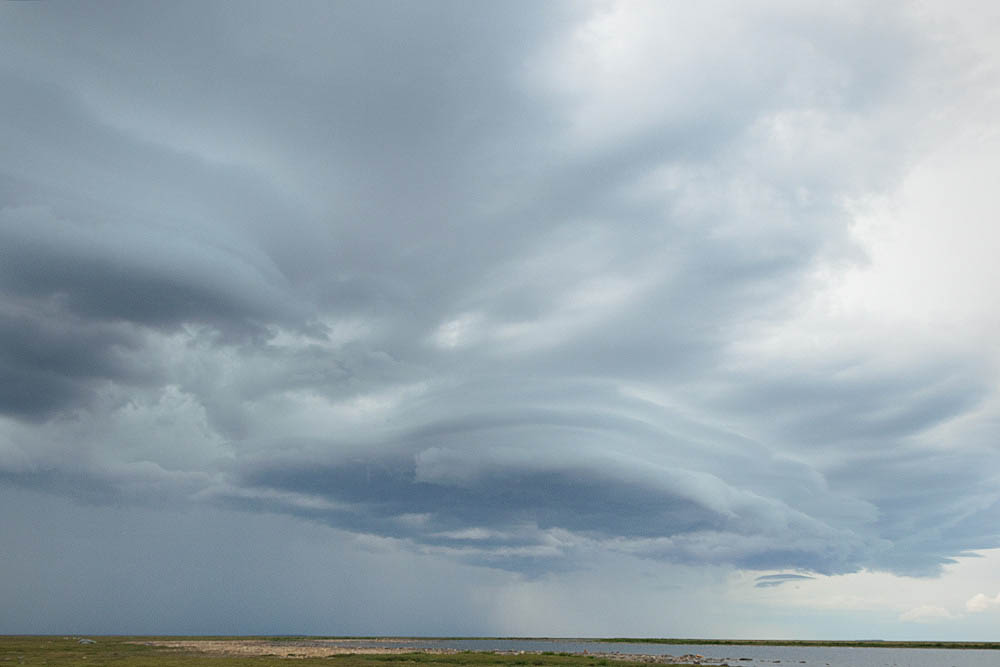 Storm clouds over arctic tundra.