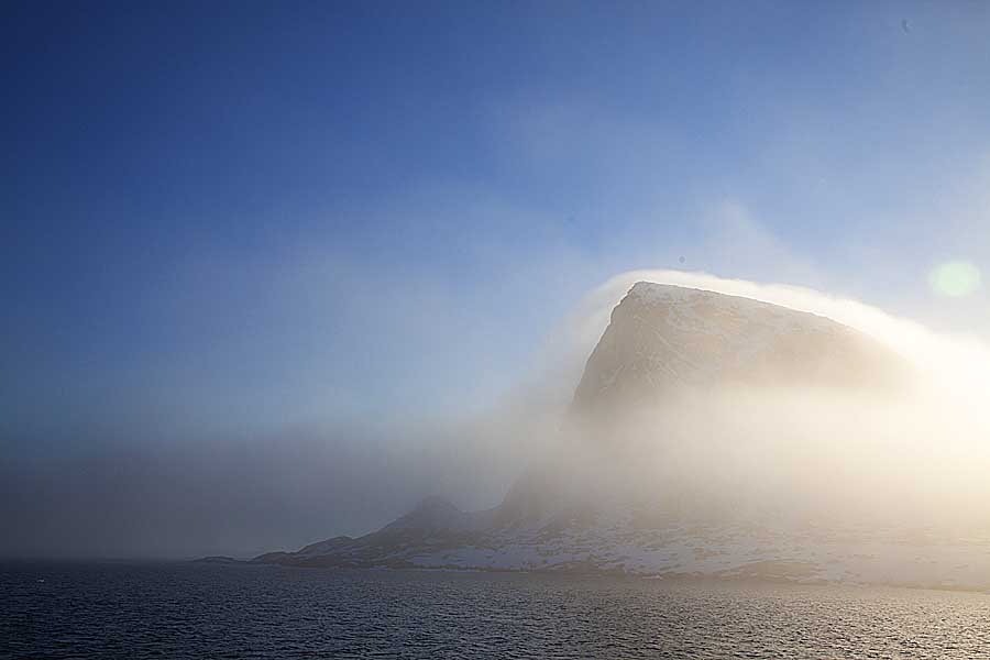 Mist and cloud formation on arctic sea cliffs.