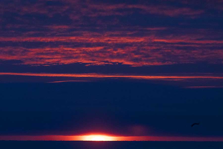 First light and sunrise of new year above arctic circle after 3 months of polar night.