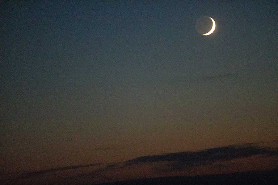 Moonrise, with waxing crescent, and first light of new year above arctic circle after 3 months of polar night.