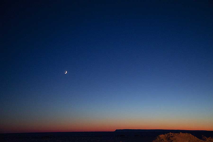 Moonrise, with waxing crescent, and first light of new year above arctic circle after 3 months of polar night.