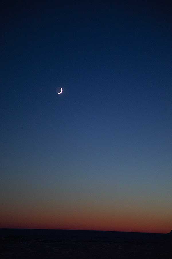 Moonrise, with waxing crescent, and first light of new year above arctic circle after 3 months of polar night.