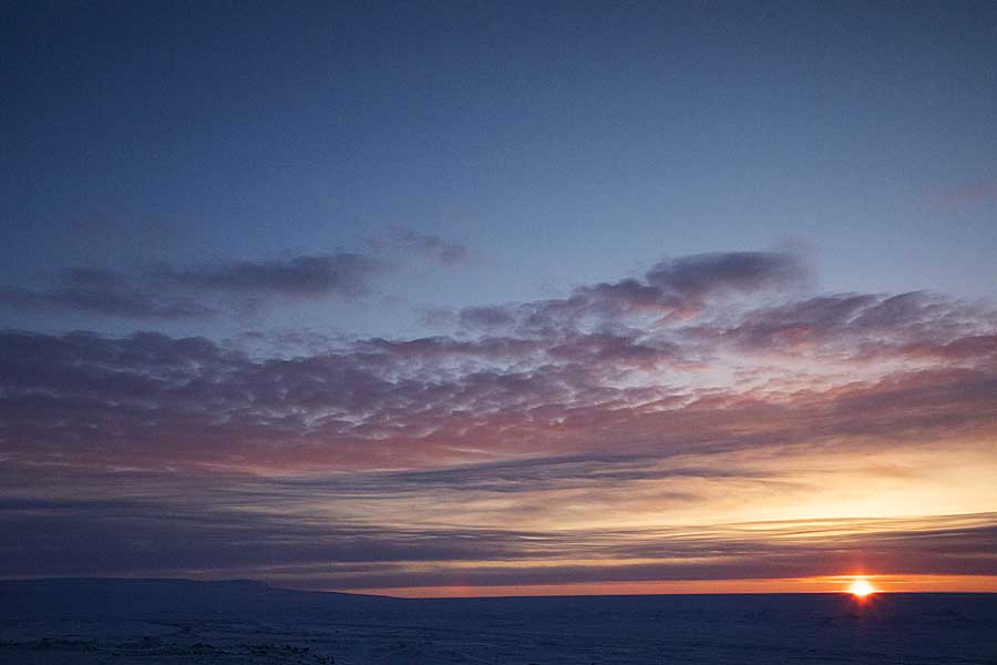 First light and sunrise of new year above arctic circle after 3 months of polar night.